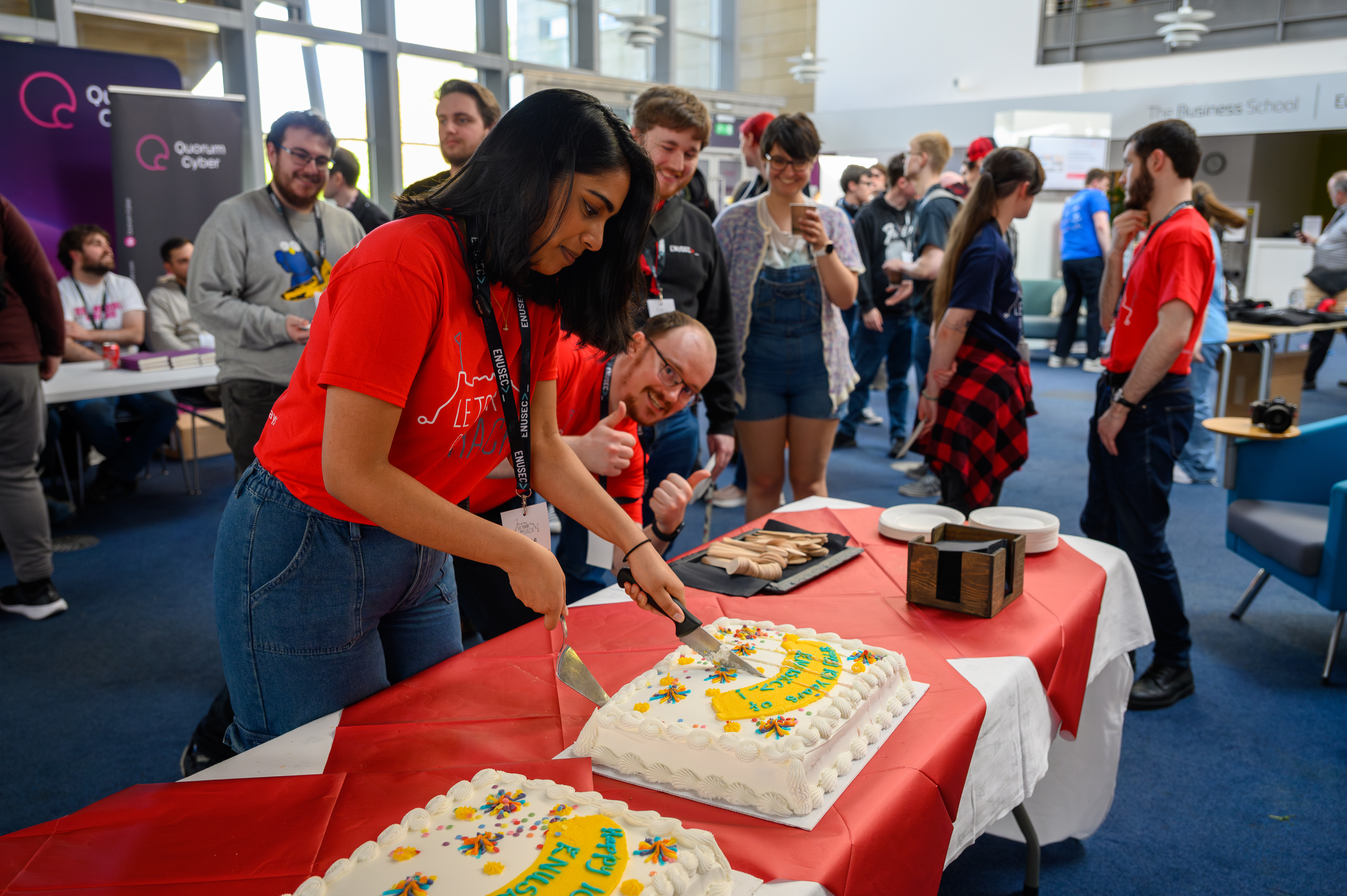 Cutting the 10 years of ENUSEC cake at Le Tour Du Hack 2025