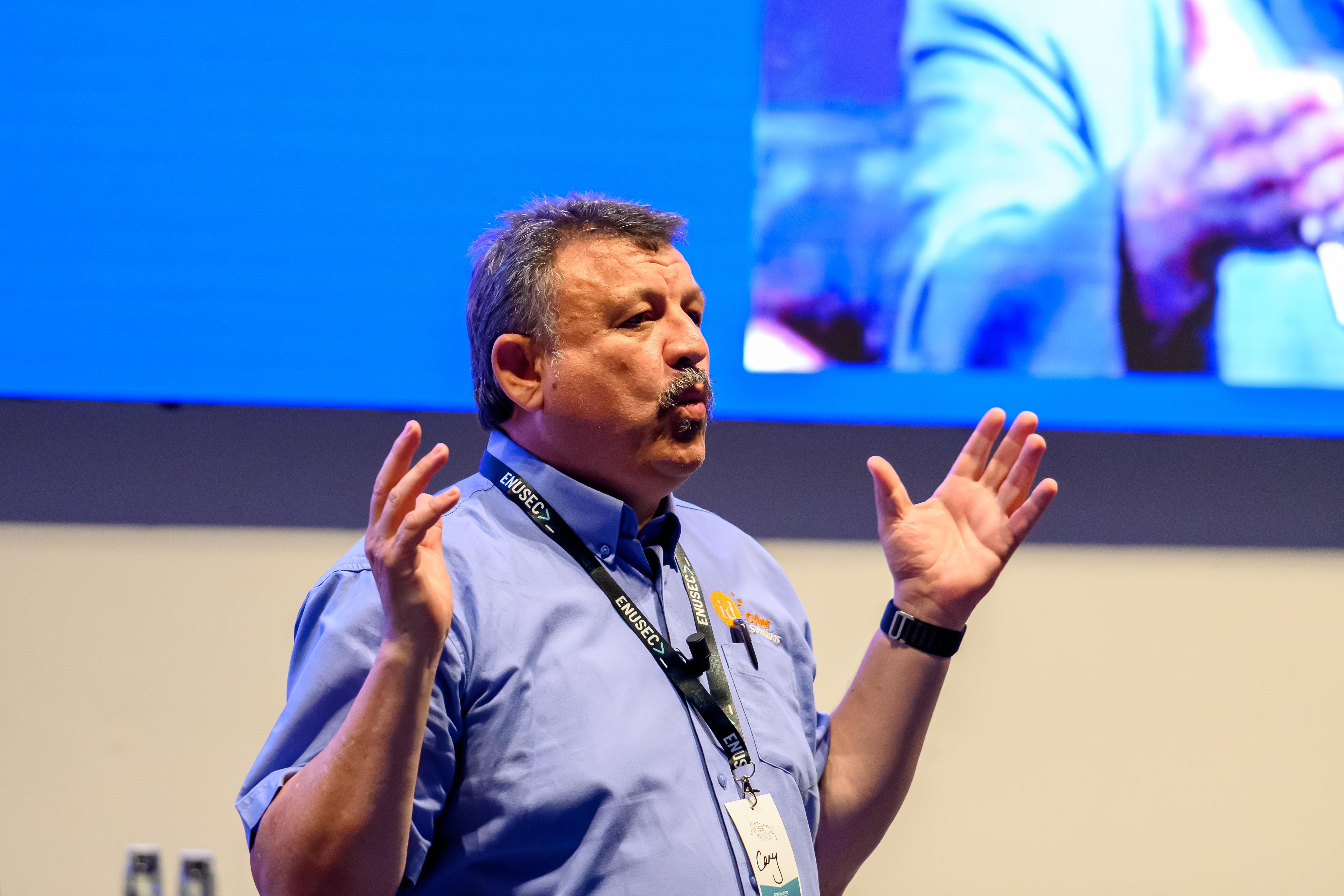 Carry Hendricks on stage at Le Tour Du Hack 2025 delivering the Locknote